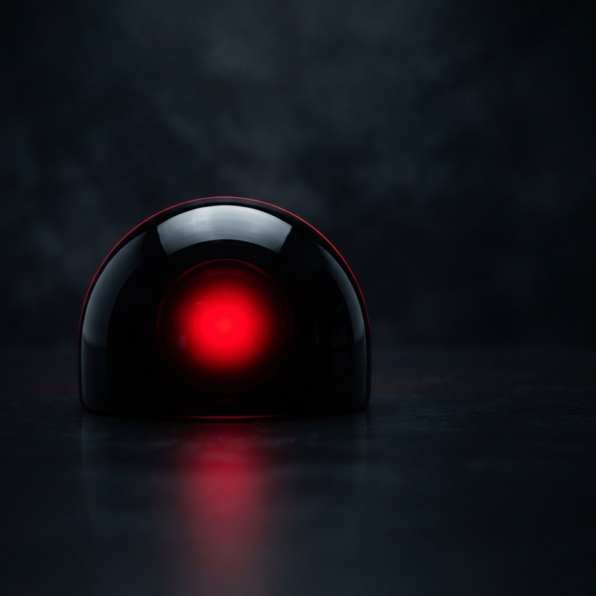 Glossy black form with a red glow — the reddysite engine motif